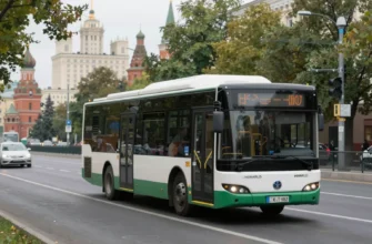 A modern electric bus driving down a tree-lined street in Moscow, with a backdrop of iconic Moscow architecture and green spaces. Focus on the bus's sleek design and the overall urban environment.